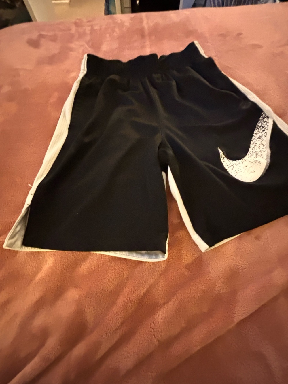 Nike Black Athletic Shorts with White Swoosh and Side Panels